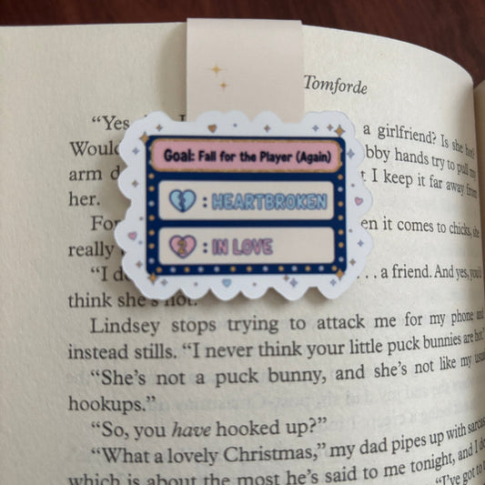 Heart-themed hockey bookmark on an open book with text