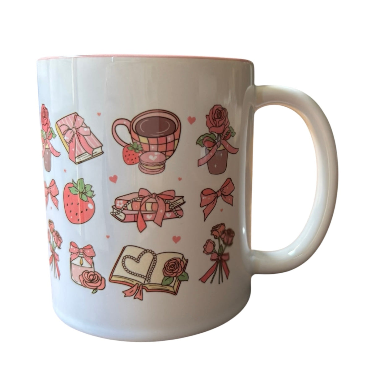 White mug with decorative pink illustrations on a white background