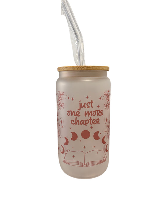 Tumbler with 'just one more chapter' text and moon phases design on a white background