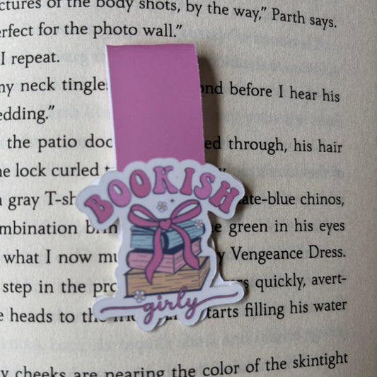Pink 'Bookish Girly' bookmark on a book page