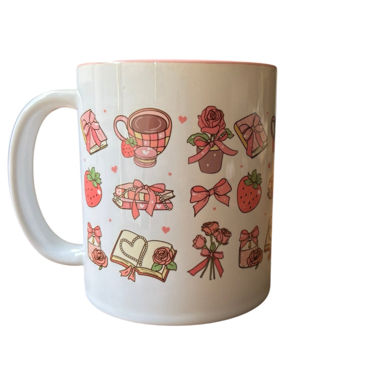 White mug with decorative patterns including roses, bows, and strawberries on a white background