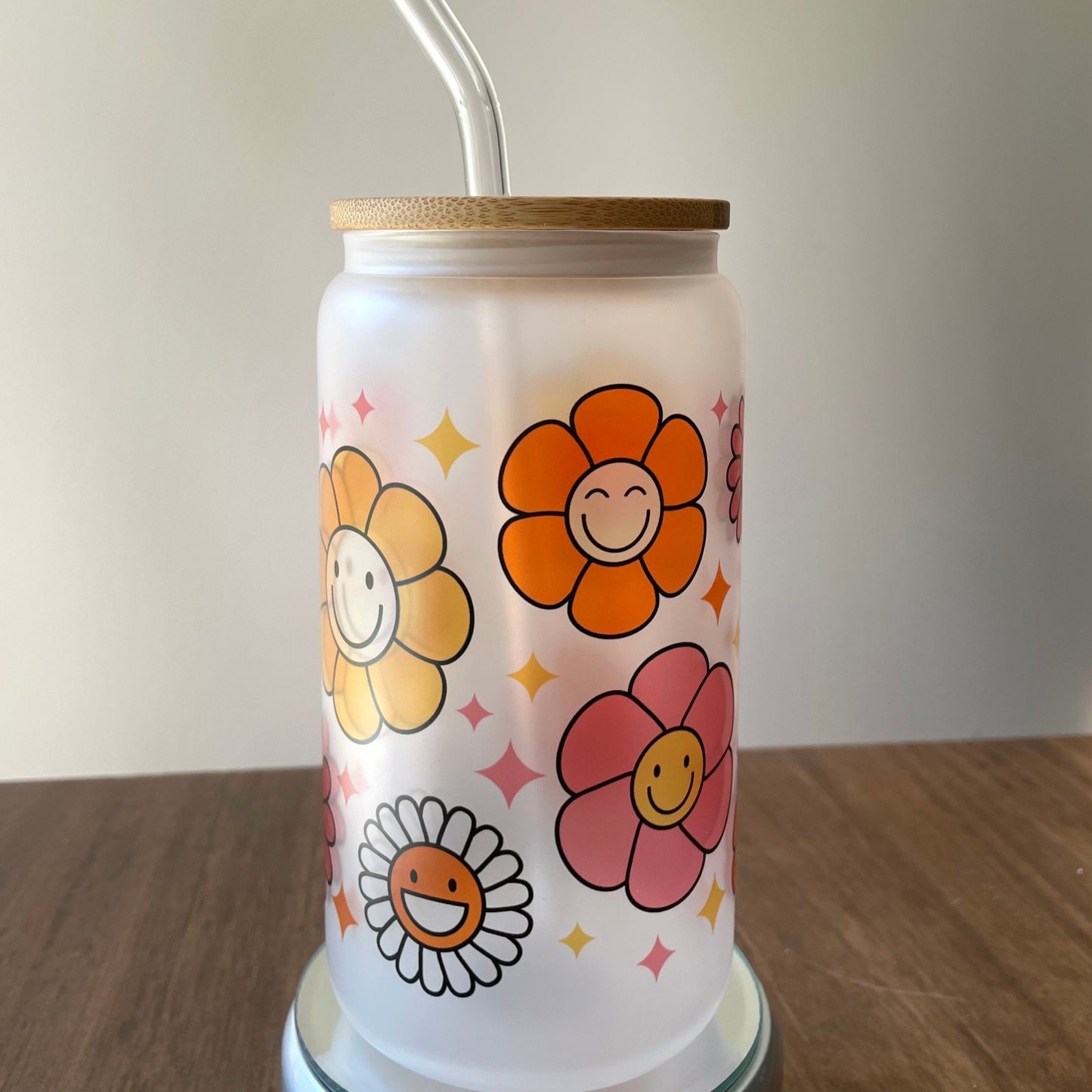 Flowers with Faces Sublimated 16oz Frosted Libbey Glass Can with Bamboo Lid and reusable straw.