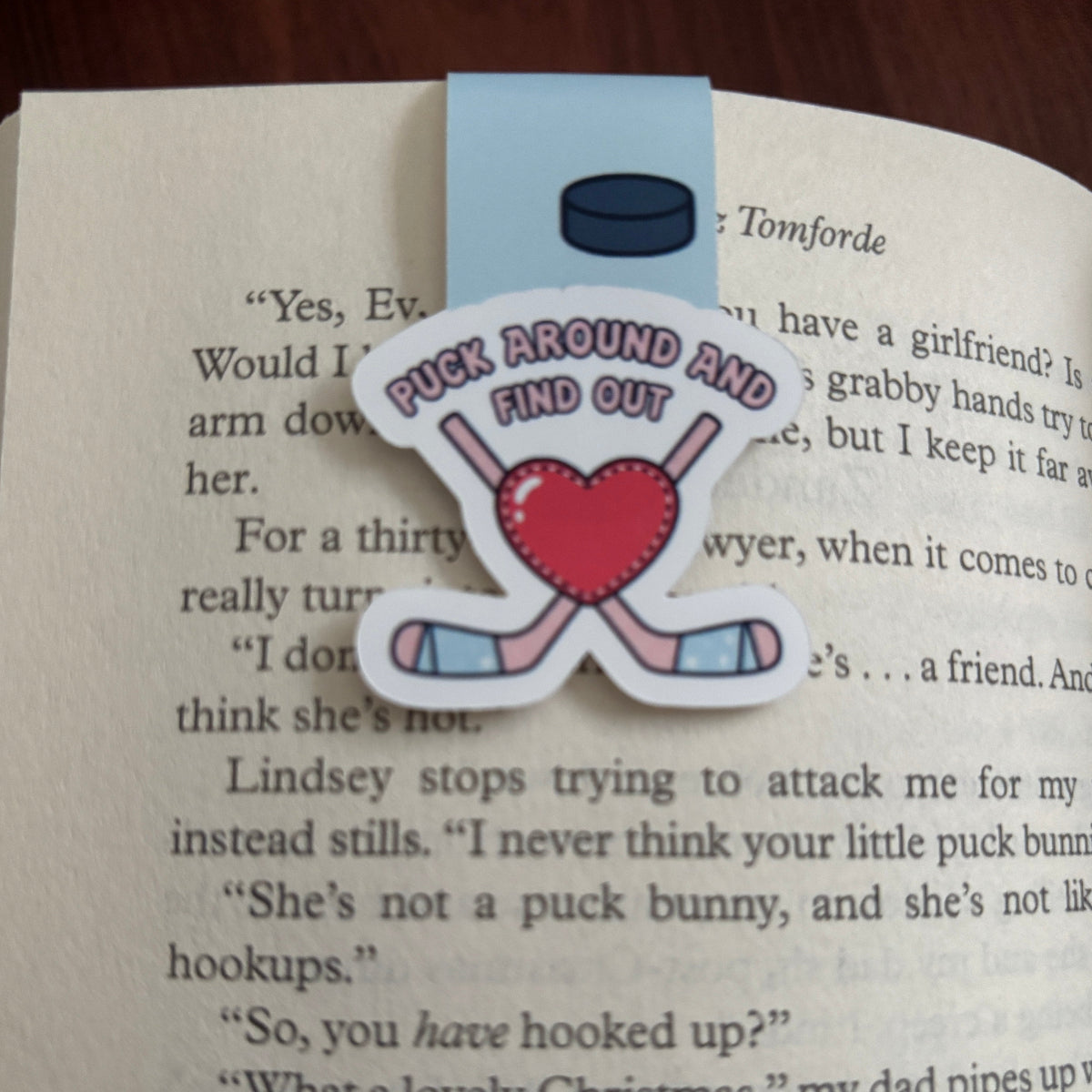 Bookmark with hockey-themed design on an open book