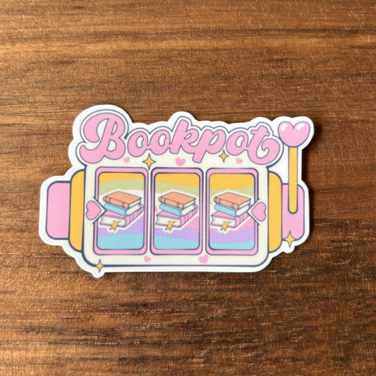 Sticker with 'Bookpot' text and book illustrations on a wooden surface