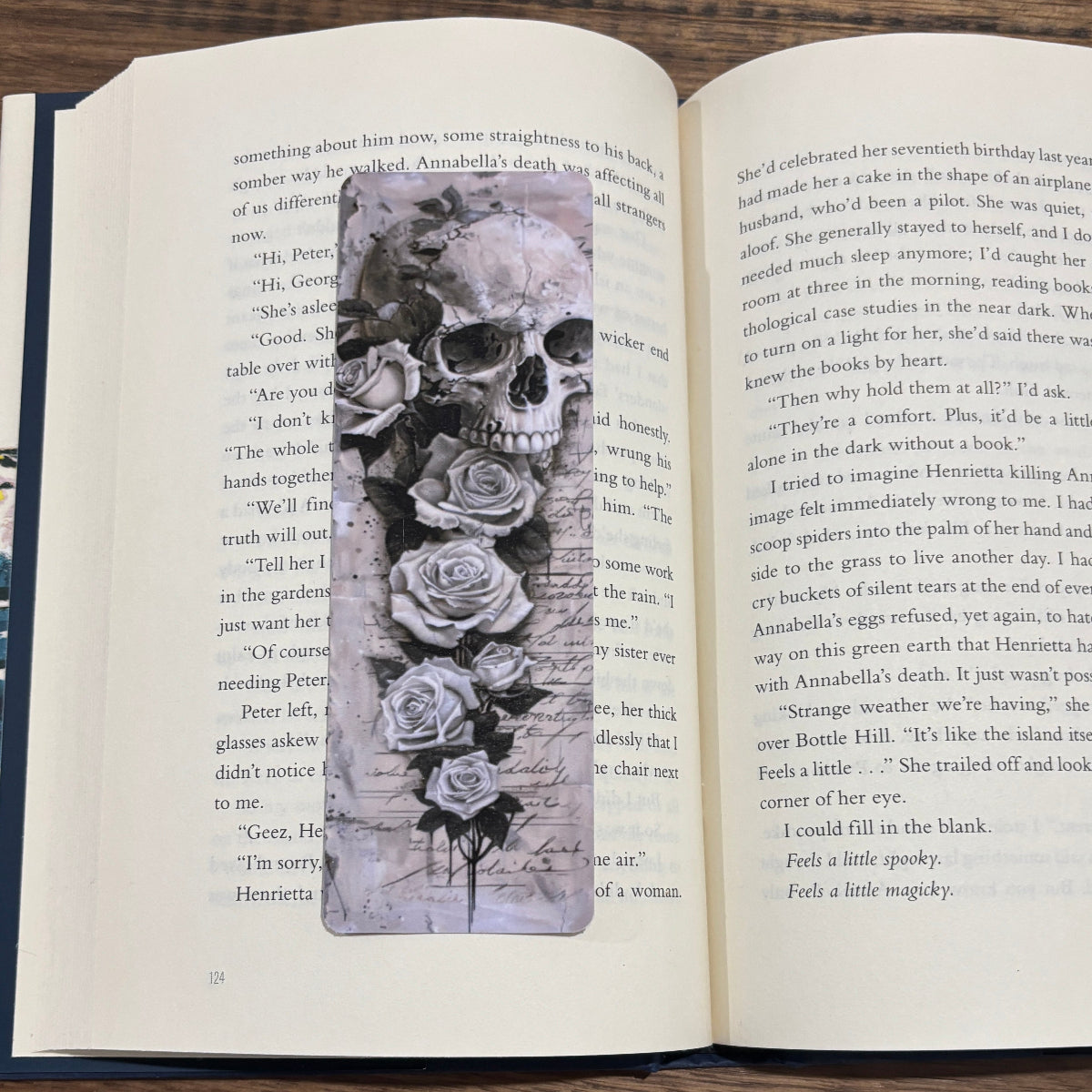 skull and white roses on bookmark