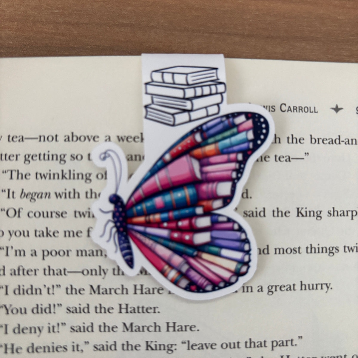 Butterfly-shaped bookmark with book design on a page of text