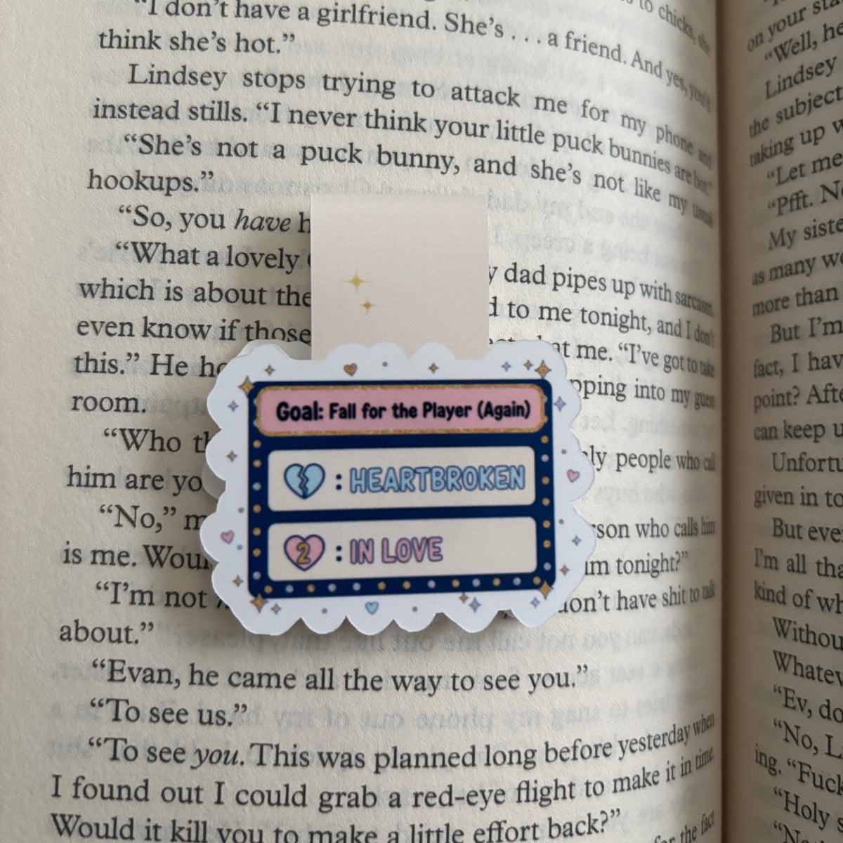 Bookmark with text and heart graphics on an open book