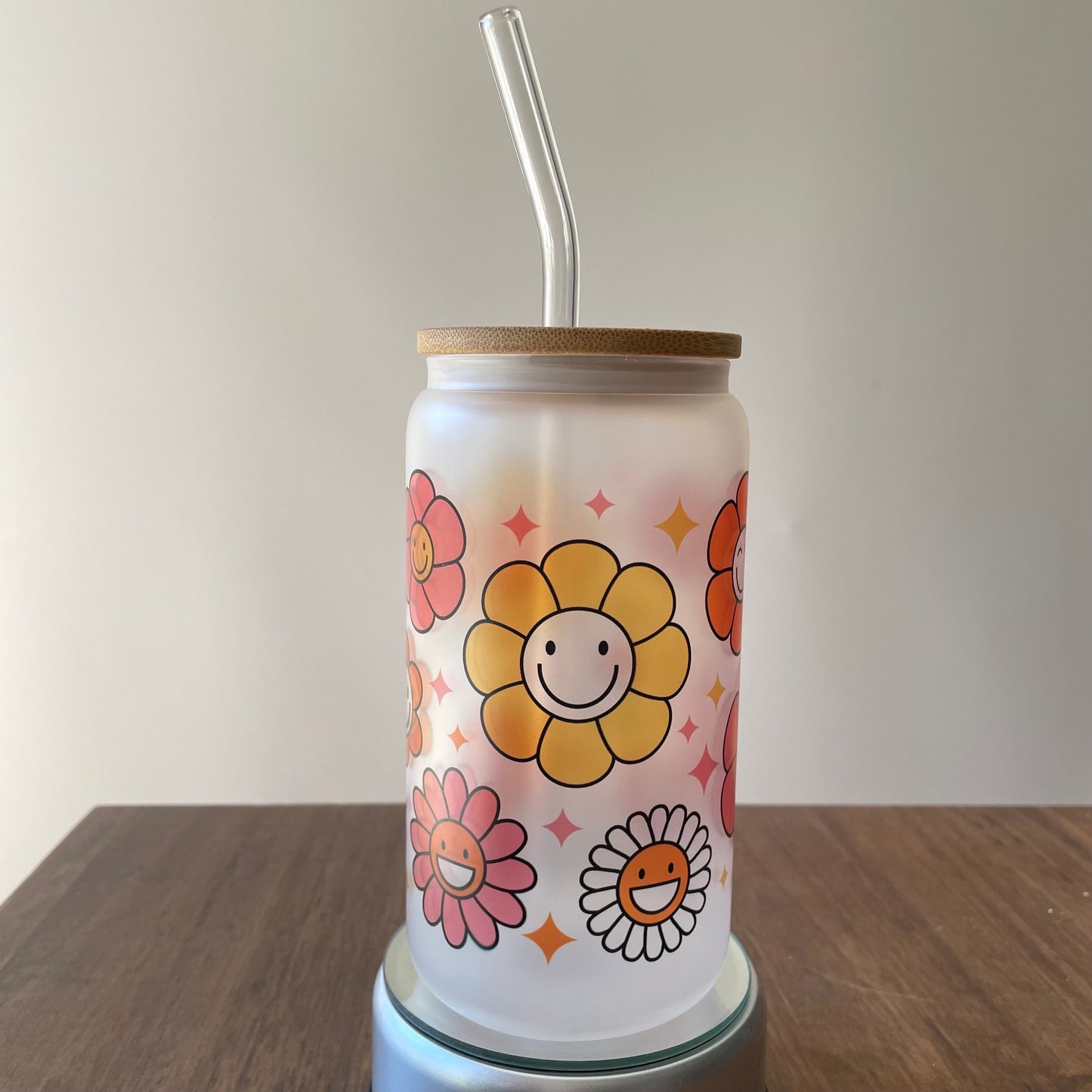 Flowers with Faces Sublimated 16oz Frosted Libbey Glass Can with Bamboo Lid and reusable straw.